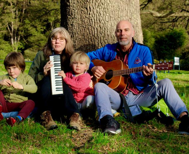 Dunedin music duo Mr Roberelli (Jen and Rob Wigley) gather with their children Oscar (5, left)...