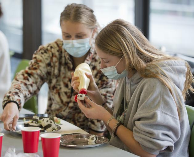 Ana Gibson (left) and Ella Wilson create panda-shaped sushi.