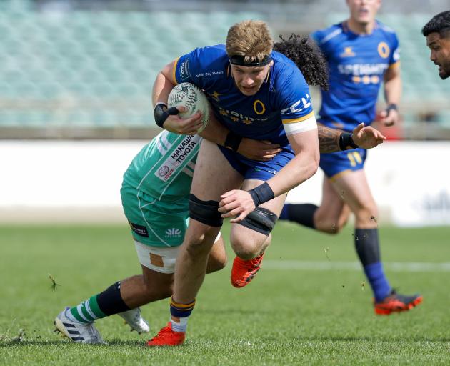 Fabian Holland of Otago is tackled during his side’s NPC match against Manawatu at Central Energy...