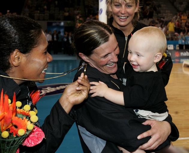 A young Max with mum Belinda Colling and fellow Silver Ferns Vilimaina Davu (left) and Irene van...