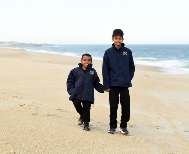 Kalya Kandegoda Gamage (right) rescued younger brother Kithmi from violent swells off Chrystalls...