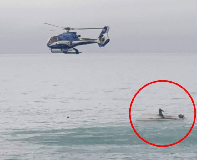 Photos of the rescue operation after a boat capsized at Goose Bay. Photo: Supplied