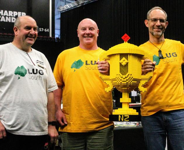 Lego User Group South secretary and trustee Gavin Evans (left) poses with New Zealand’s first...