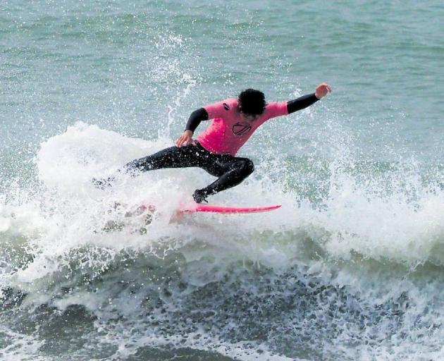 Surfing well . . . National U18 National Champion and local Waikuku surfer Rakiatea Tau in action...