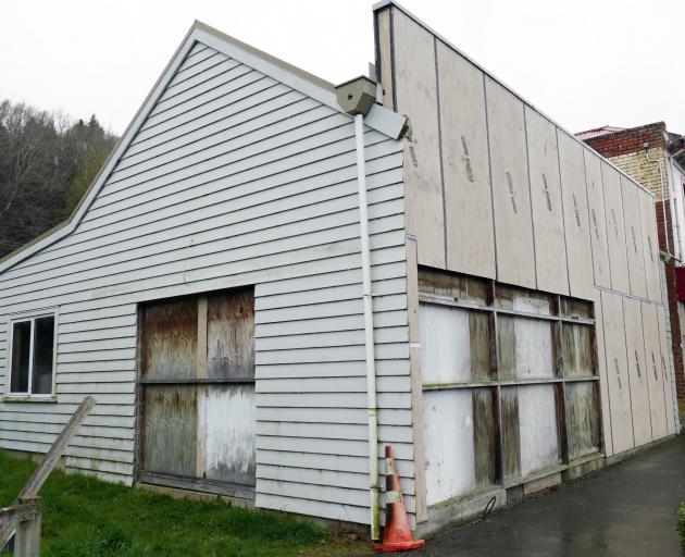 A shop in Lawrence’s main street remains boarded up after at least four years and may now be the...