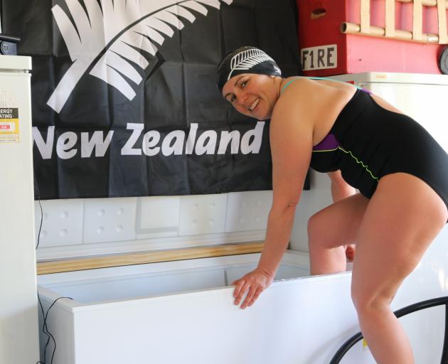 Hannah Drury climbs into the freezer she has set up to help her in her preparations for next year...