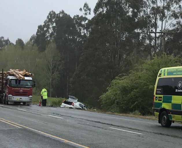 Emergency services at the scene of the crash where a car went down a bank on State Highway 1....