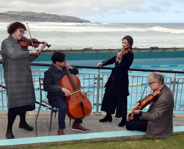 Playing to the public at the St Clair Hot Salt Water Pool yesterday are New Zealand Symphony...