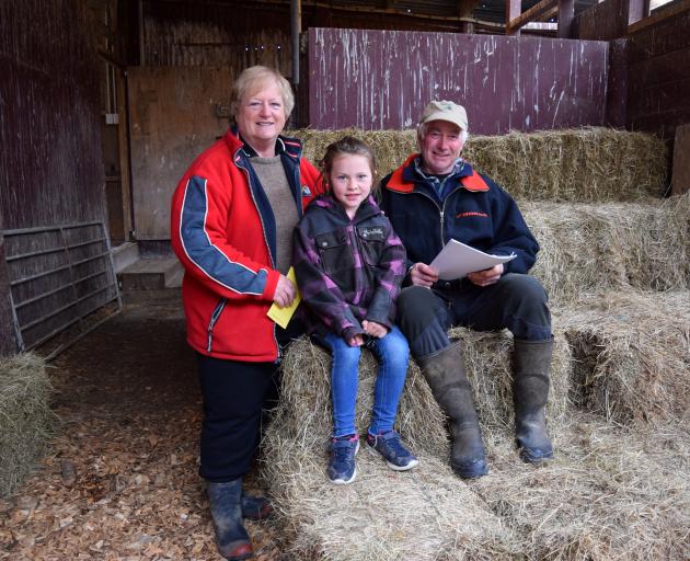 Farmers Raewyn and Graeme Black, of Gropers Bush, with granddaughter Makenzie Davie (6), paid the...