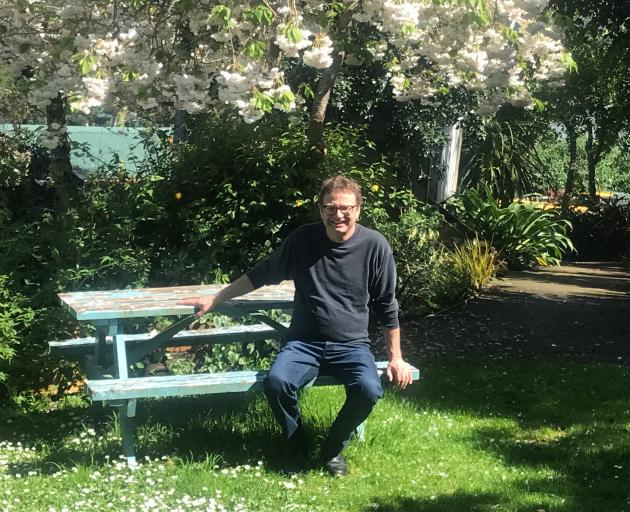 Robin Sharma relaxes for a moment in his Port Chalmers garden. PHOTOS: GILLIAN VINE
