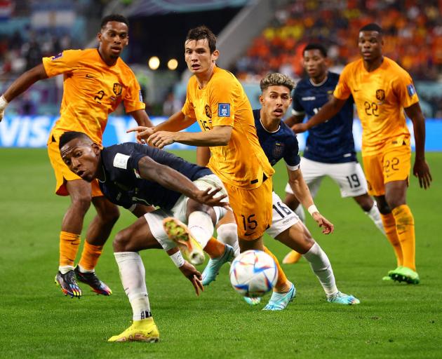 Ecuador's Pervis Estupinan in action with Netherlands' Marten de Roon and Jurrien Timber. Photo:...