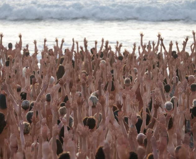 About 2500 people took part in the photo shoot at Bondi Beach on Saturday. Melanoma is Australia...