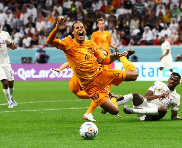Netherlands defender Virgil van Dijk reacts after a challenge. Photo: Reuters