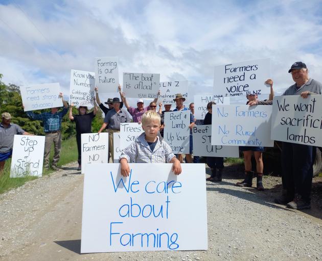 Third-generation East Otago farmer Nate Roy (2) joins a protest alongside his parents and...
