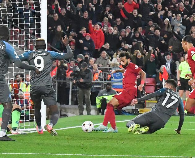 Liverpool's Mohammed Salah turns the ball into the back of the net against Napoli. Photo: Getty...