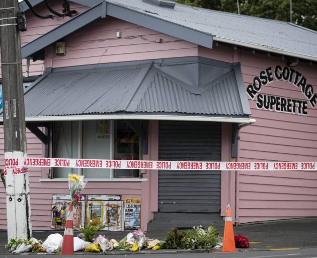 Flowers have been left outside the Rose Cottage Superette in Sandringham. Photo: NZ Herald