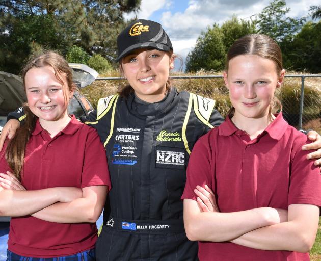 Silver Fern Rally co-driver Bella Haggarty (14), of Christchurch, is flanked by Clutha Valley...