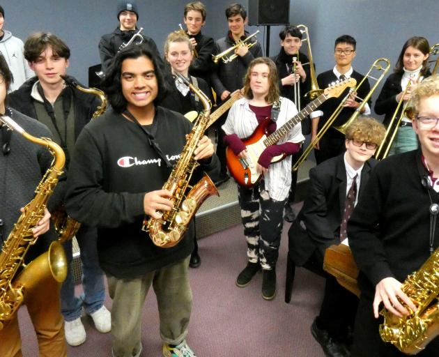 Some members of the Logan Park Jazz Band tune up for a trip north to take part in the Southern...