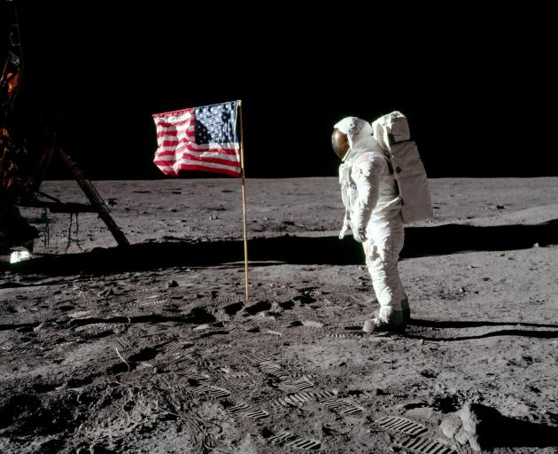Astronaut Buzz Aldrin stands beside the United States flag on the moon, July 20, 1969. Or does he...