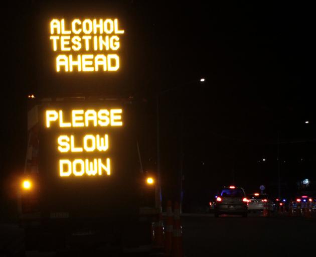 Breath-testing is carried out in Quarry Rd, Mosgiel last Friday night. PHOTO: OSCAR FRANCIS