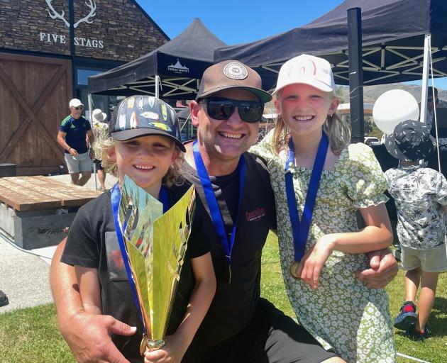 Simon Oliphant, of Melbourne, with his children Charlie (6) and Lucy (9), who all won places in...