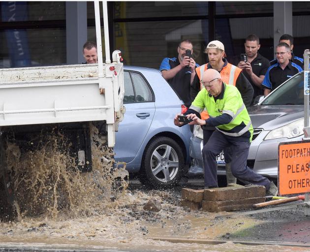 A contractor's truck helped stem the geyser. Photo: Stephen Jaquiery