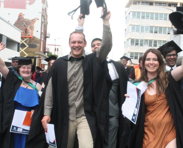 Celebrating their graduation from the Southern Institute of Technology yesterday are...