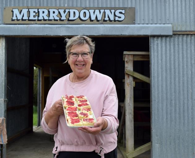 Kathryn Salter, of Chatton, serves her scones at the annual Merrydowns on-farm ram sale in West...