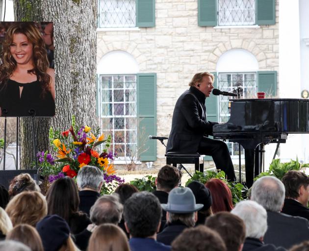 Axl Rose performs during the public memorial for singer Lisa Marie Presley at Graceland Mansion...