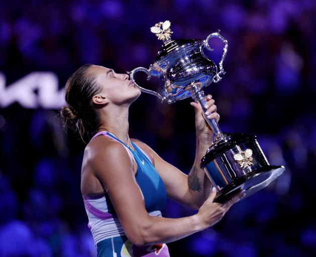 Aryna Sabalenka celebrates with the trophy after winning the Australian Open title on Saturday....