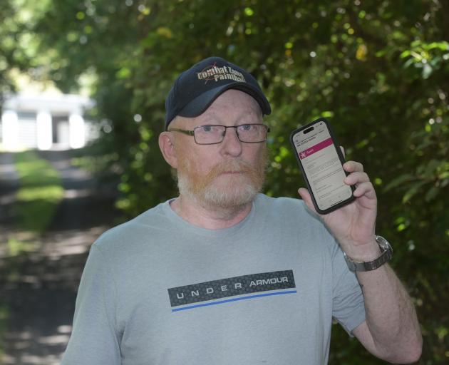 Brian Thornley displays a quote from Spark on his phone for $11,849.60 to connect fibre broadband...