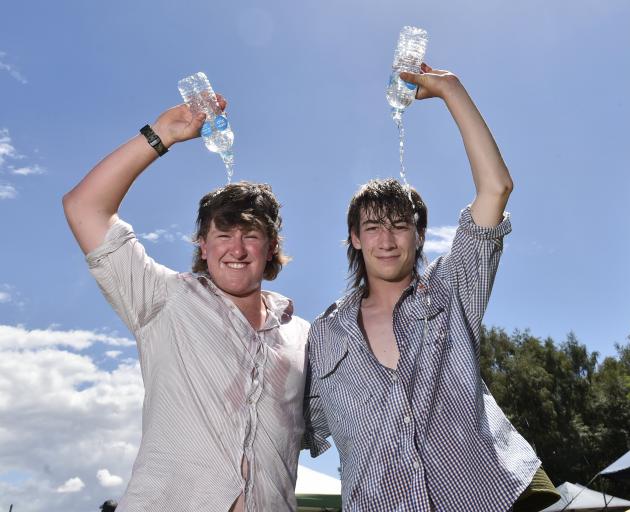 Finn O’Brien (16, left), of Lauder, and Rafe Davidson (17), of Alexandra, cool off in the hot...