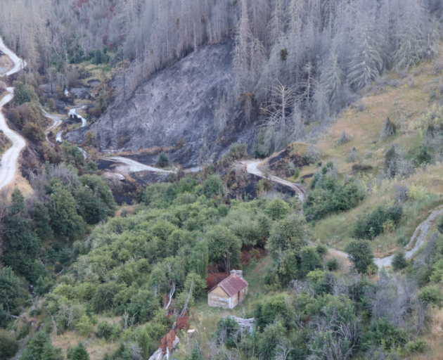 The historic hut was not damaged by the fire. Photo: Fire and Emergency New Zealand