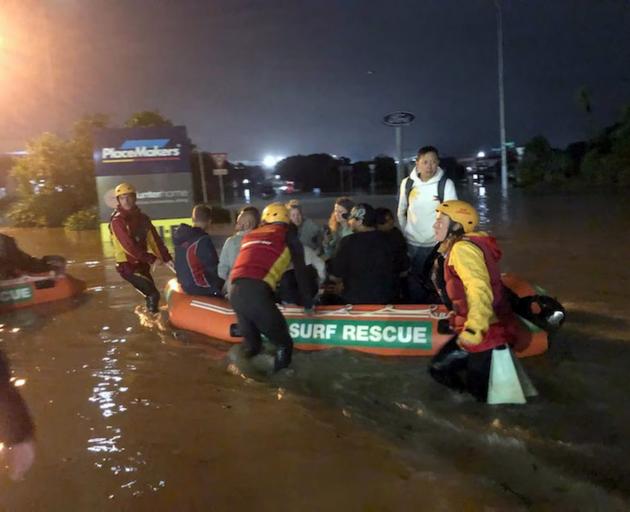 Search and rescue lifeguard squads rescue Auckland residents during the flooding on Friday night....