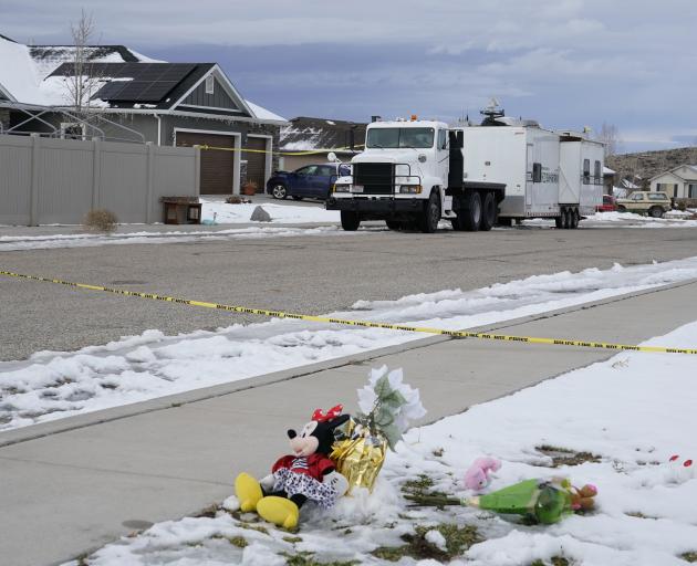 A makeshift memorial sits outside the home of the Haight family in Enoch, Utah after a man shot...