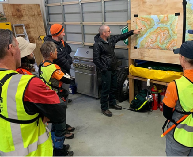 The search and rescue team is briefed.