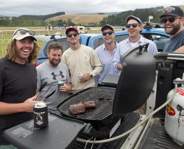Enjoying a drink by the barbecue are (from left) Brodie Hume, Karl Sefton, Shane Anderson, Shawn...