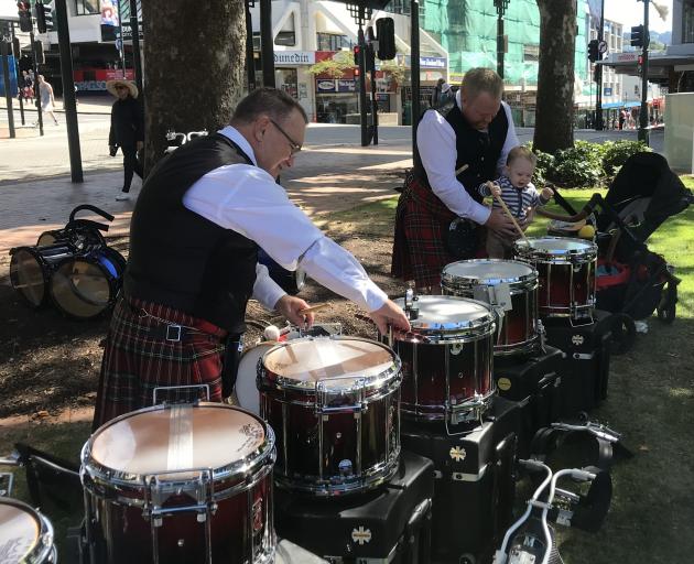 Canterbury Caledonian Pipe Band's Bruce Fraser (left) tunes snare drums with Scott Graveson and...