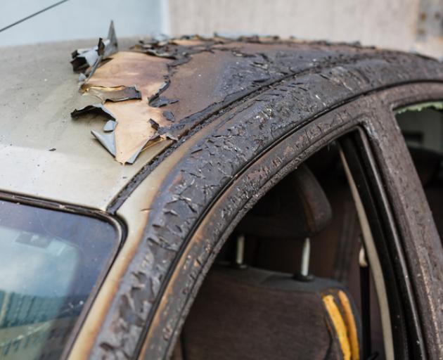 Crews extinguished the fire in the three cars parked alongside each other at the residential...