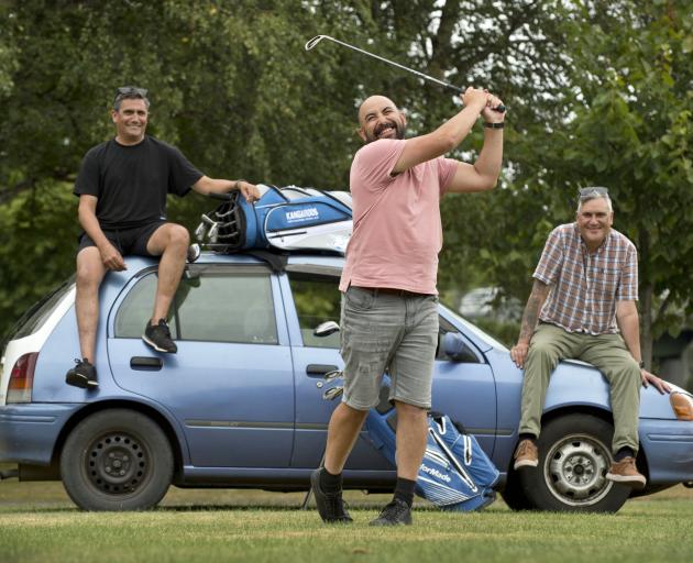 Sherman Weatherall tests his golf swing in front of his Toyota Scarlet, which he has put up for a...
