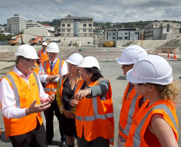 Discussing the new Dunedin Hospital construction project on site yesterday with Minister of...