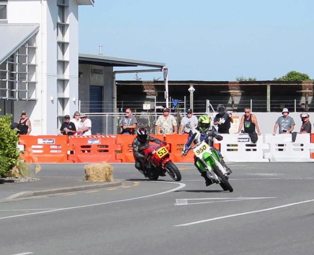 Taking a corner during the street race in Invercargill yesterday are Alan Henry (left), of North...