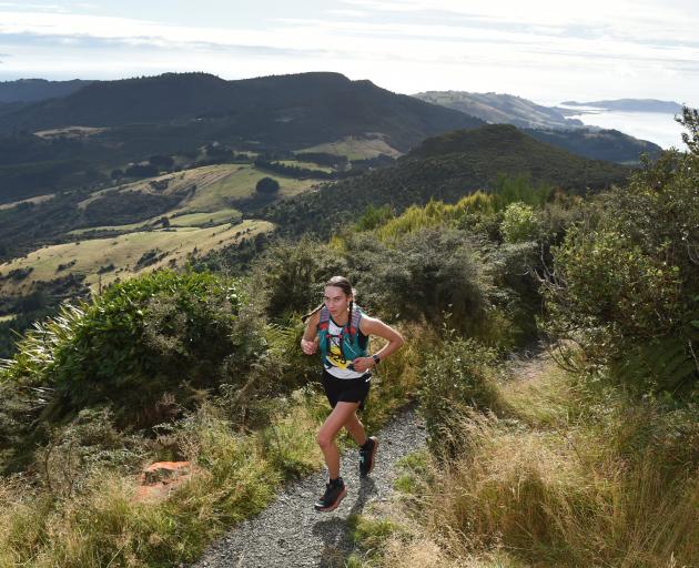 Becky de la Harpe summits Mt Cargill and begins the descent to the finish line at Chingford Park...