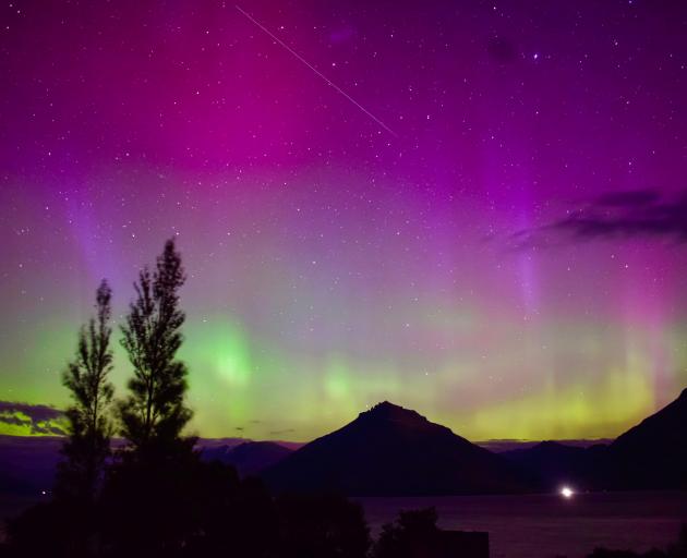 The southern lights light up the sky over Lake Wakatipu, from Jacks Point, on Monday night....
