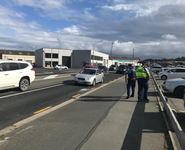 Armed police at the scene of the reported shooting incident in Thomas Burns St. Photo: Gregor...