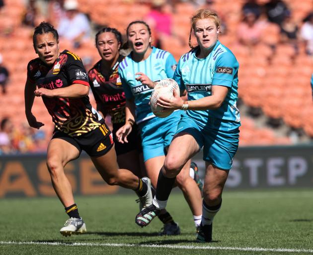 Matatū midfield back Grace Brooker makes a break during her side’s Super Rugby Aupiki match...