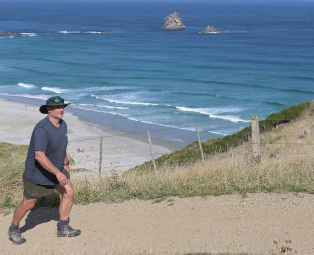 Otago Peninsula Community Board chairman Paul Pope takes a walk at Sandfly Bay, on the peninsula....