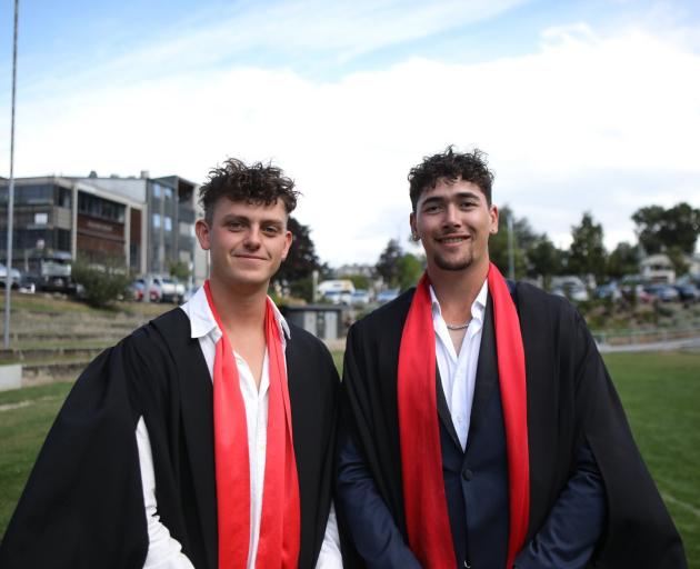 Graduating with QRC diplomas in adventure tourism management yesterday are Angus Ritchie (left)...