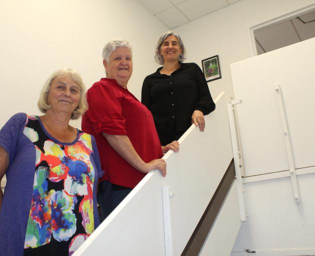 Welcoming clients to their new location at 10 George St are (from left) Brain Injury Association...