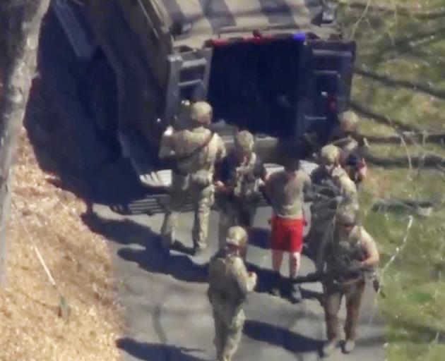 FBI agents arrest Jack Teixeira, an employee of the U.S. Air Force National Guard, in connection...